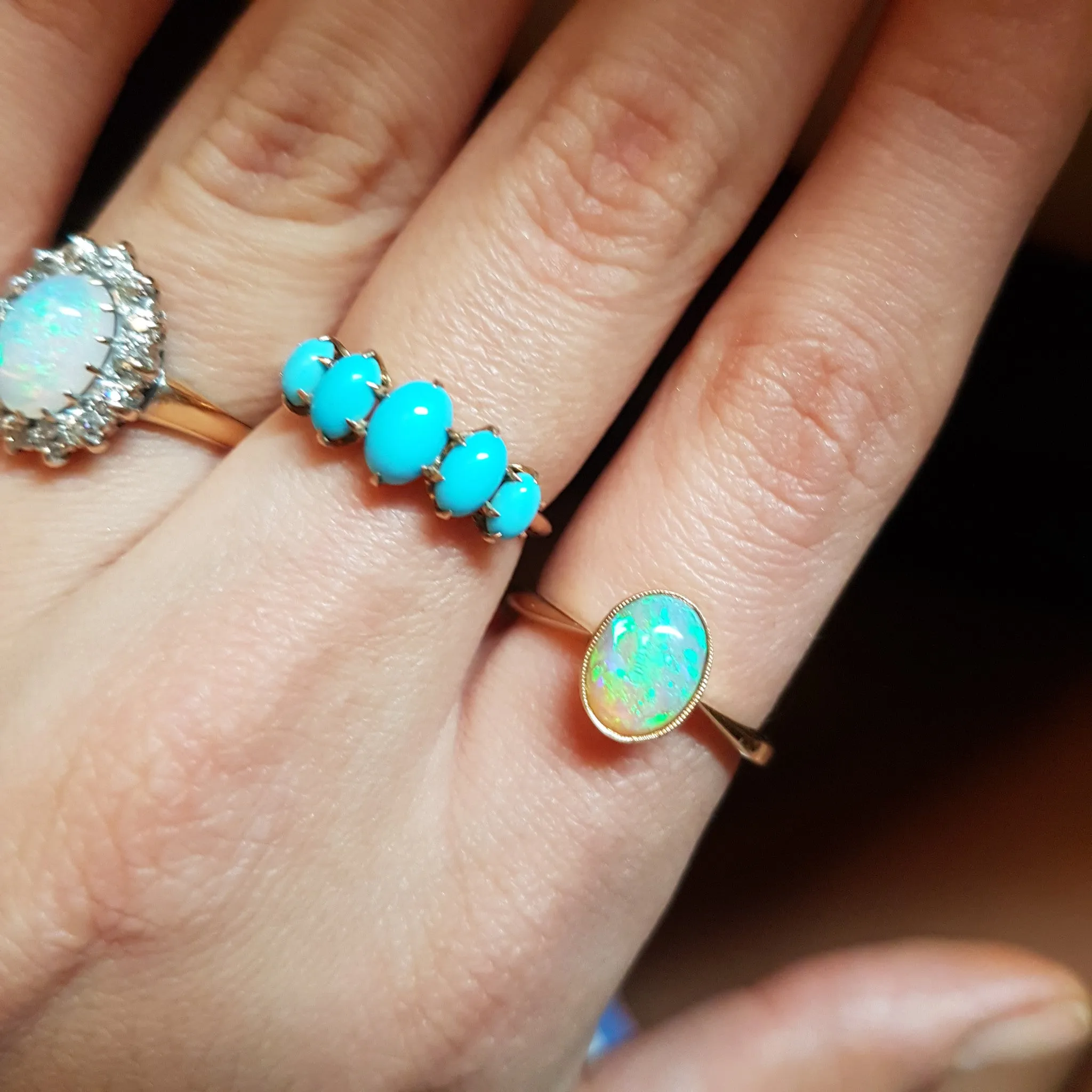 18K YELLOW GOLD AND BEZEL SET OPAL SOLITAIRE RING