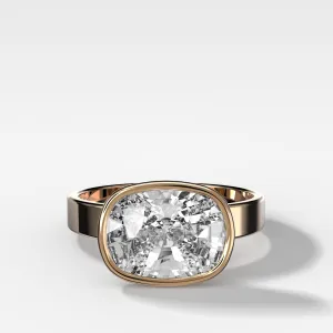 Finest Bezel Set Engagement Ring With East West Elongated Cushion Cut Diamond