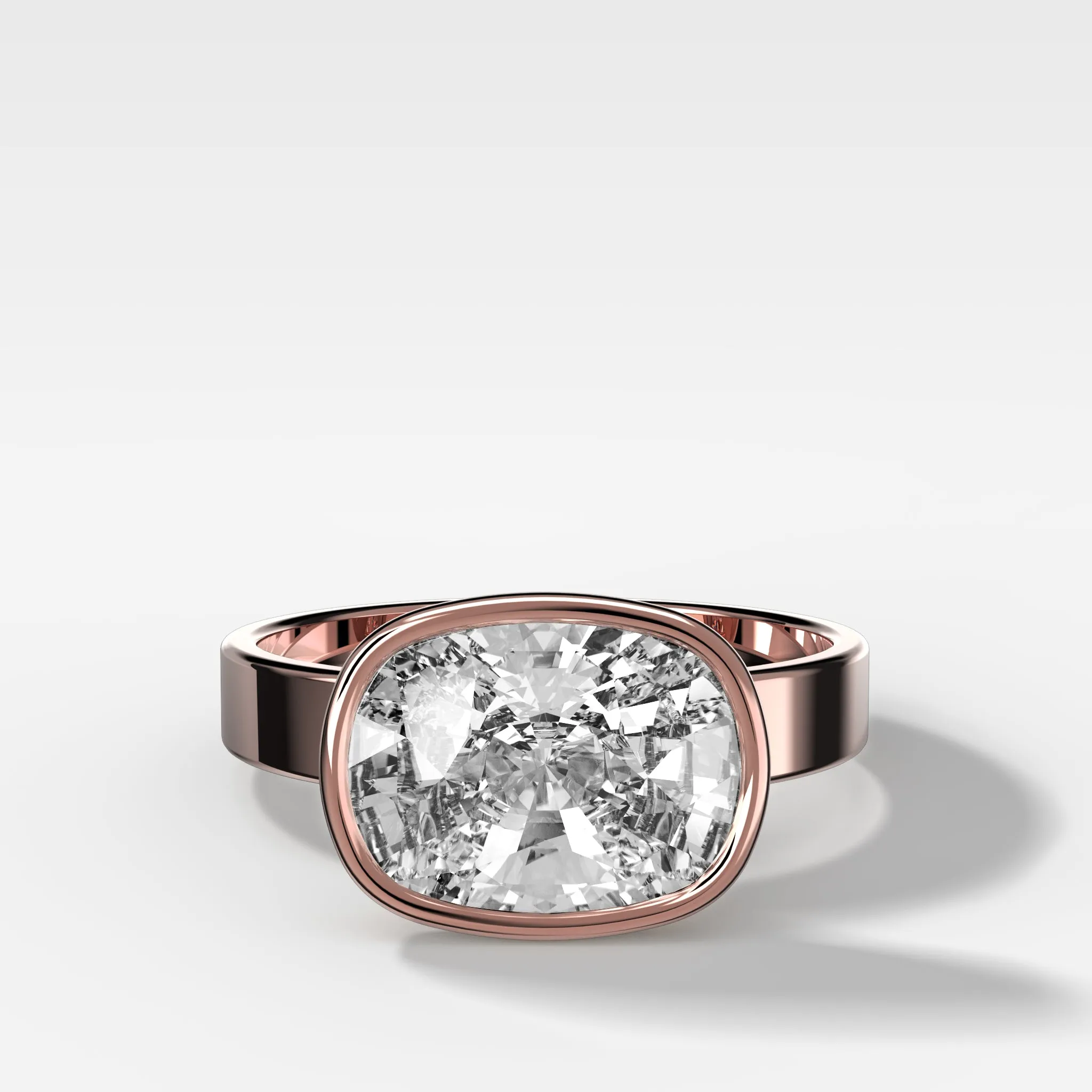 Finest Bezel Set Engagement Ring With East West Elongated Cushion Cut Diamond
