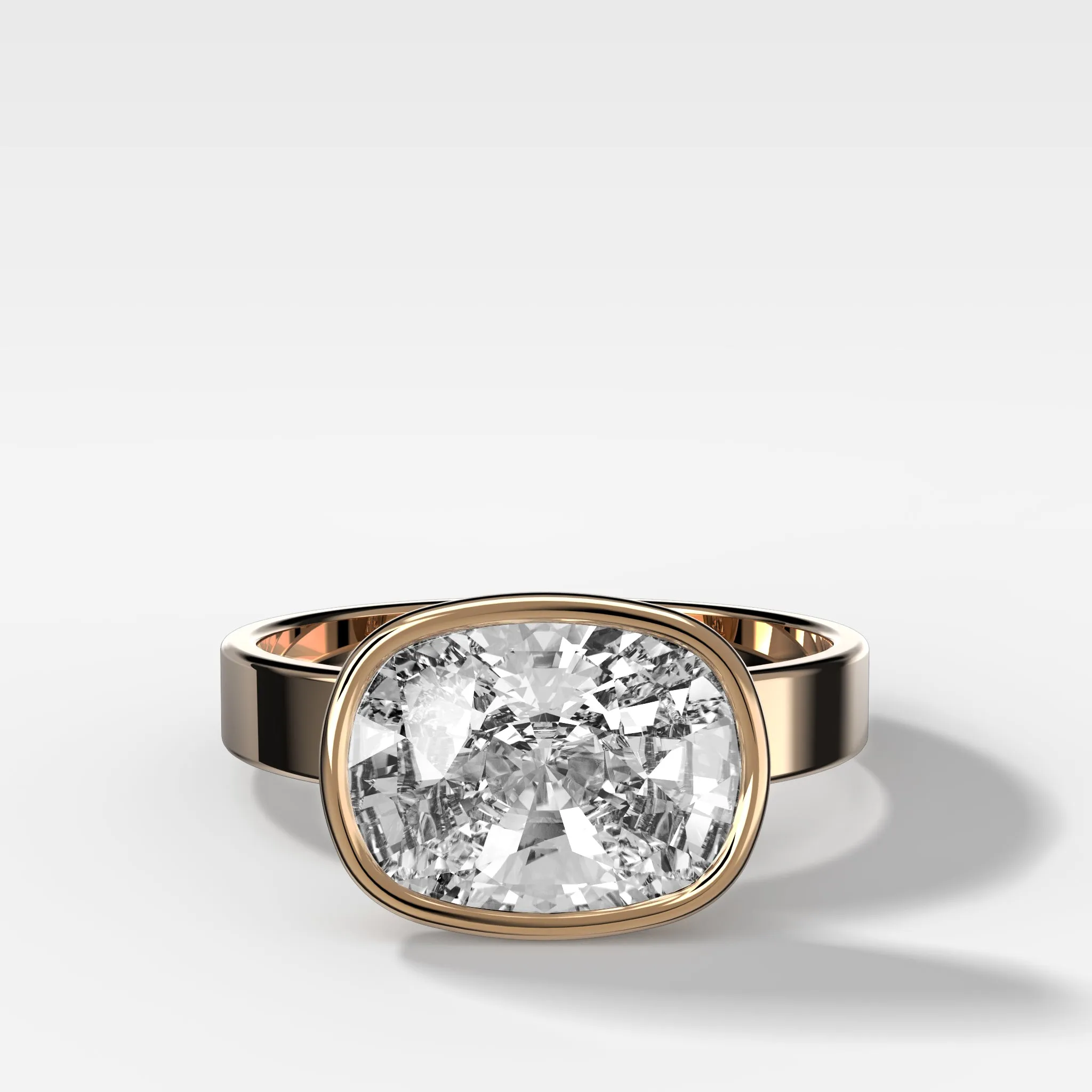 Finest Bezel Set Engagement Ring With East West Elongated Cushion Cut Diamond