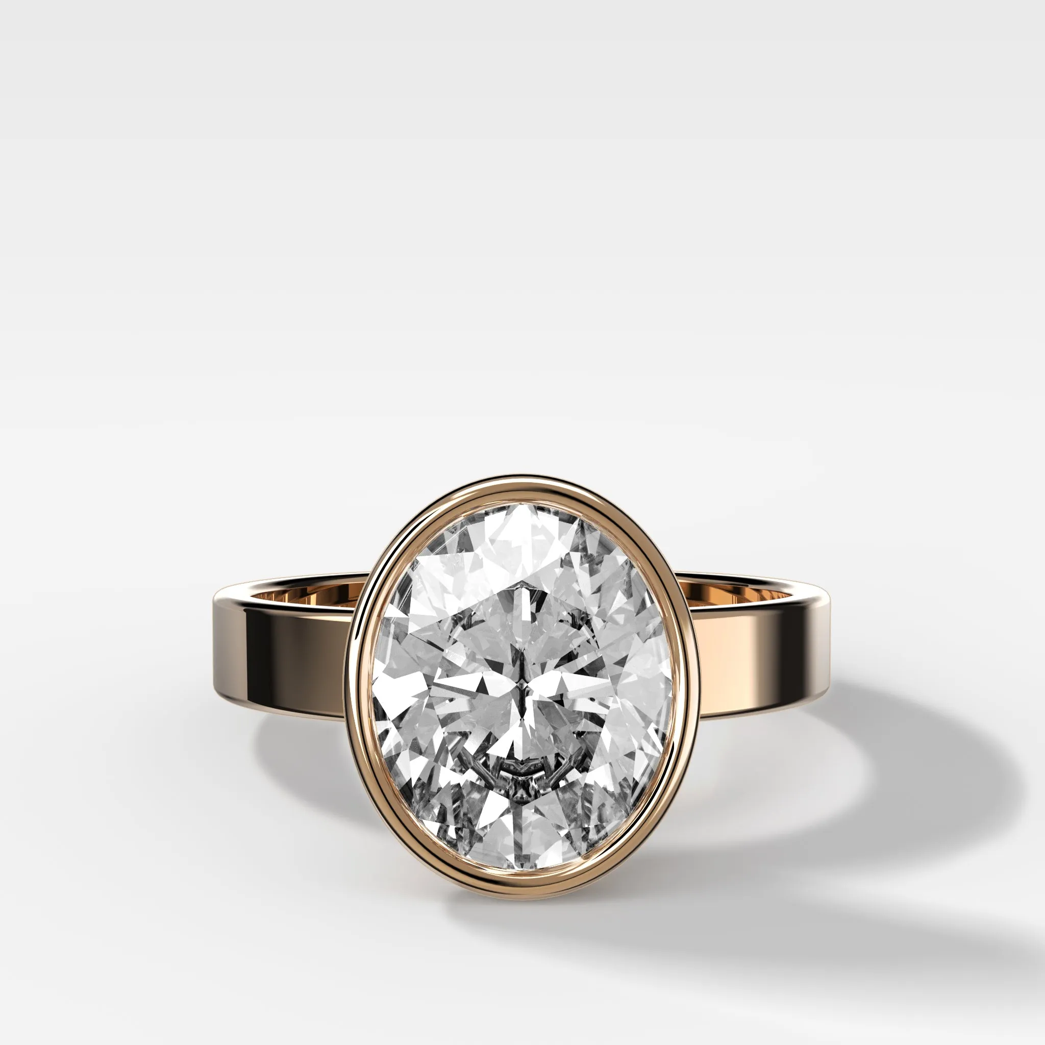 Finest Bezel Set Engagement Ring With Oval Cut Diamond