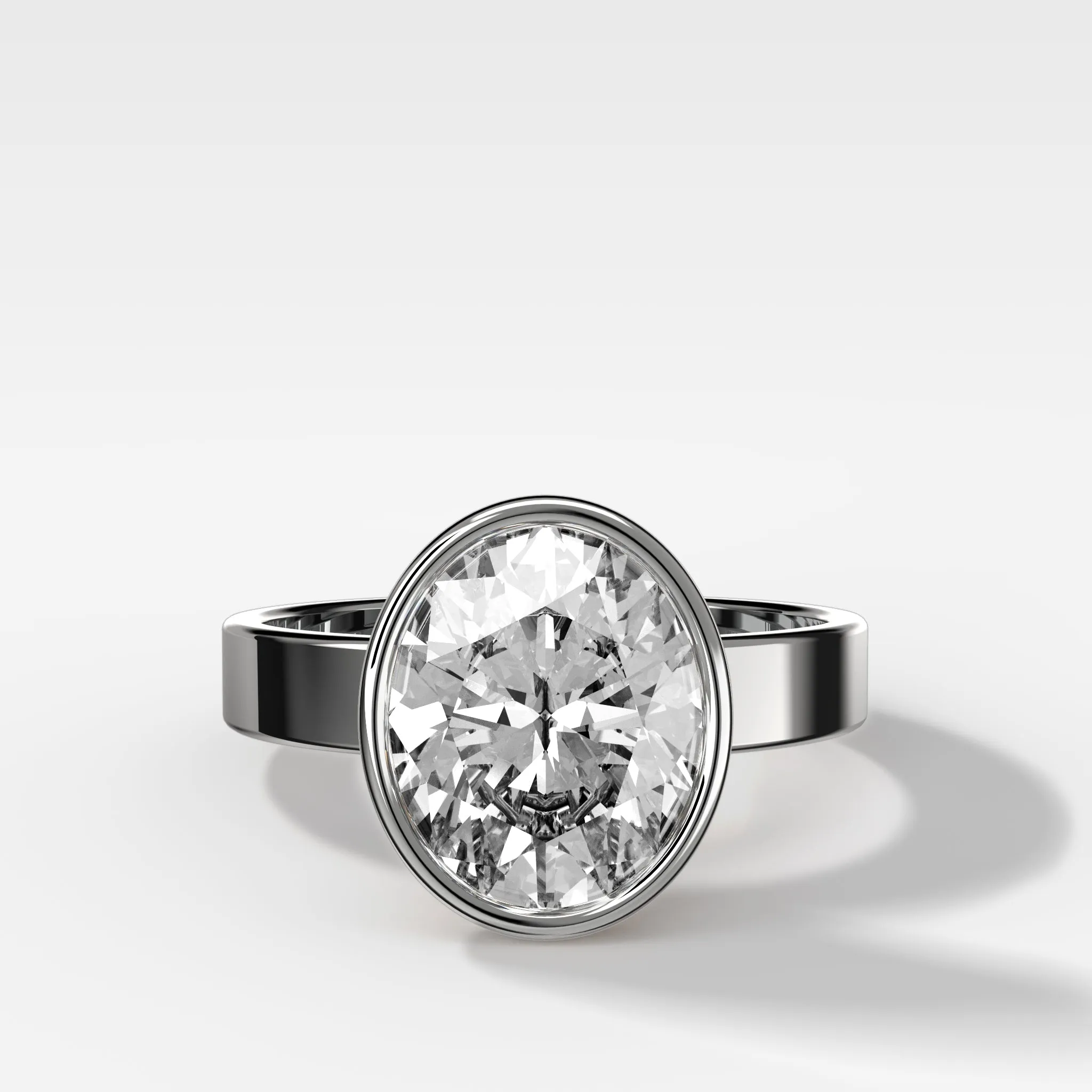 Finest Bezel Set Engagement Ring With Oval Cut Diamond