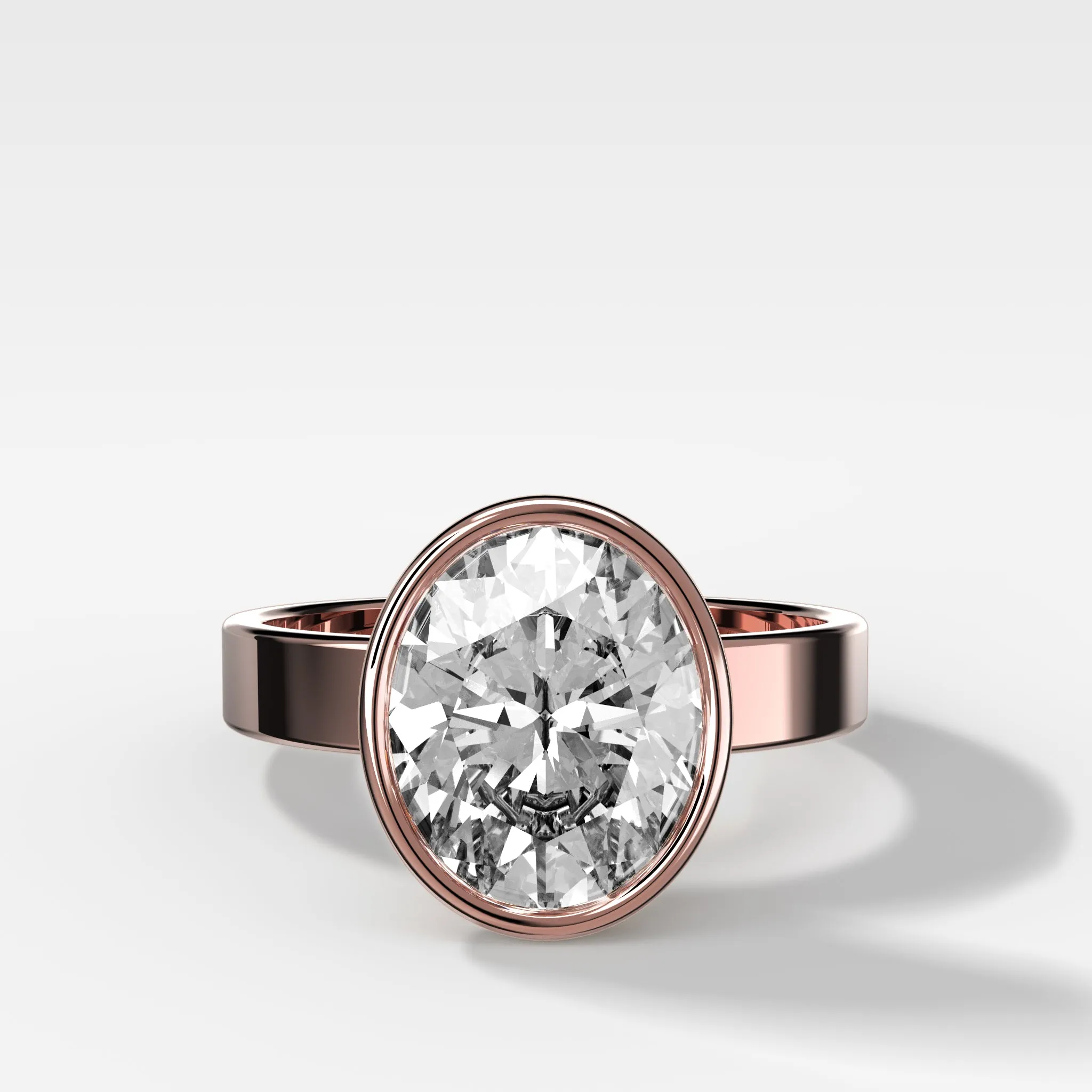 Finest Bezel Set Engagement Ring With Oval Cut Diamond