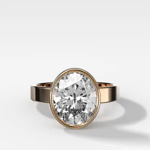 Finest Bezel Set Engagement Ring With Oval Cut Diamond