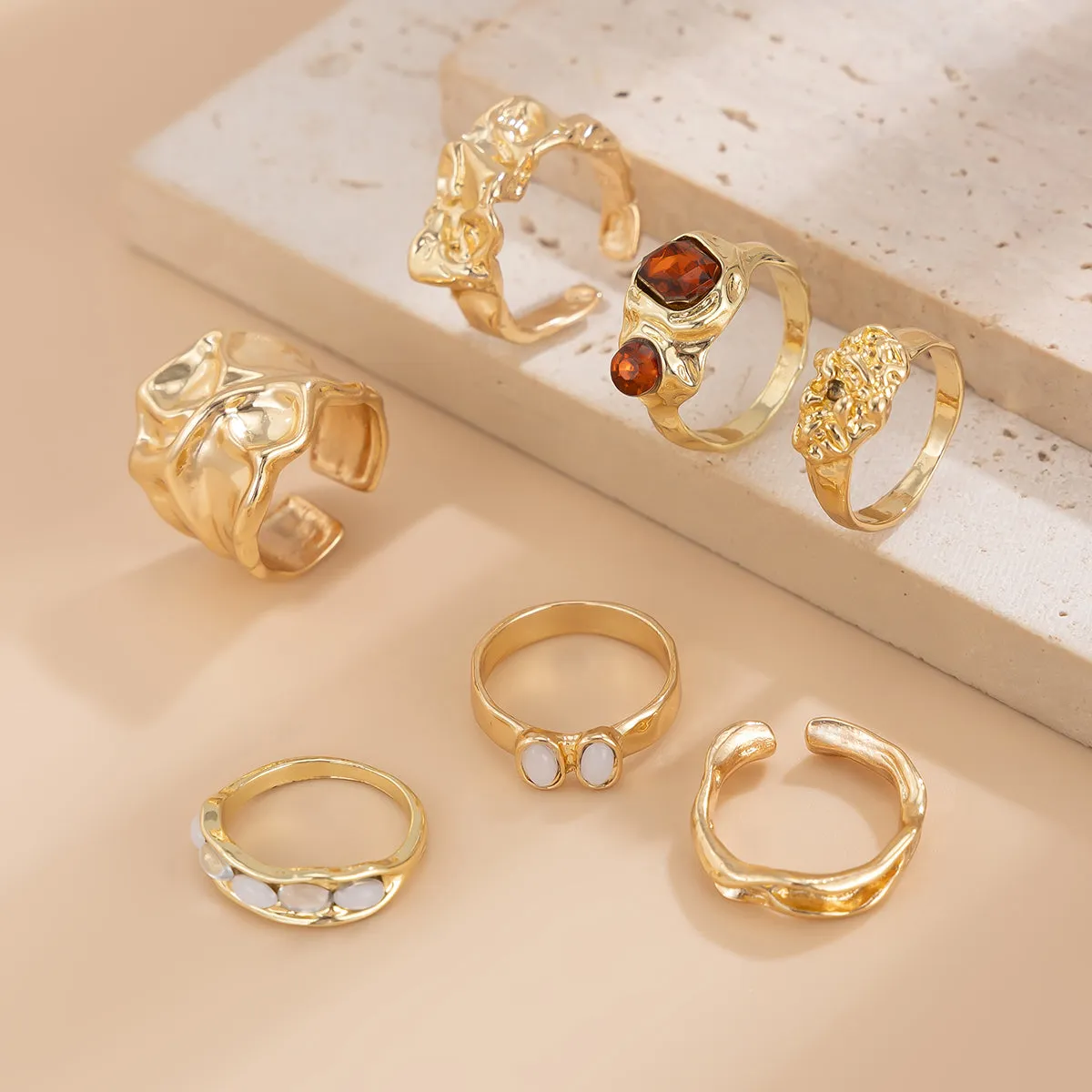 Gilded Drama: 7-Piece Statement Ring Set