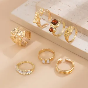 Gilded Drama: 7-Piece Statement Ring Set