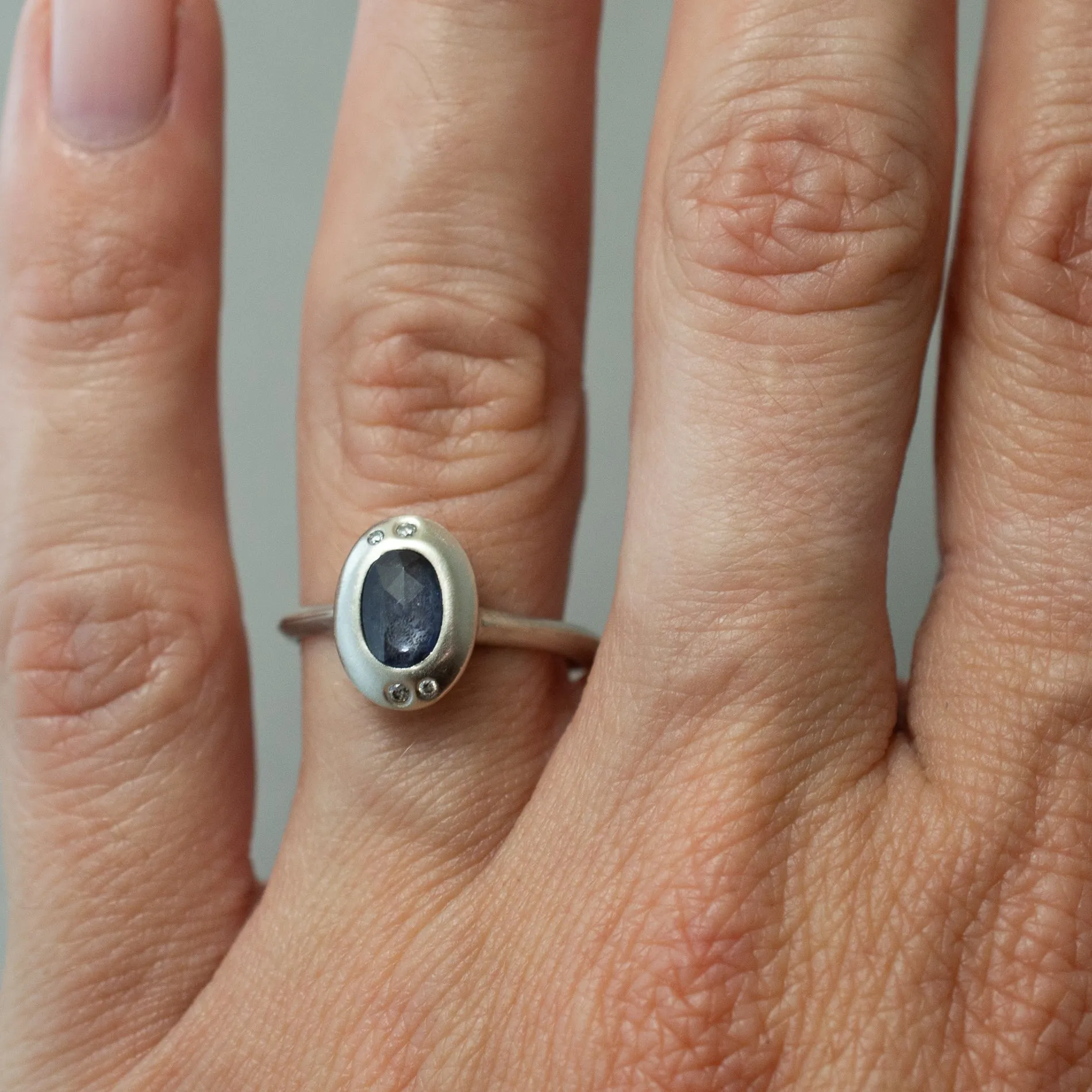 SAPPHIRE AND DIAMOND ORBIT RING