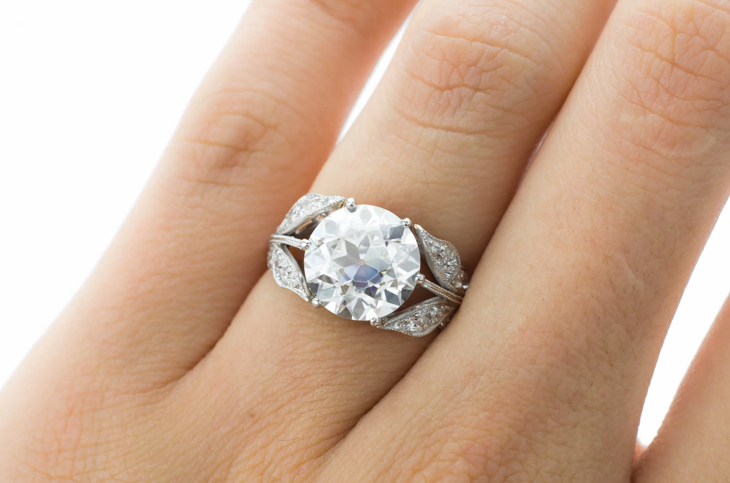 SOLITAIRE IN PLATINUM WITH DIAMOND ACCENTS