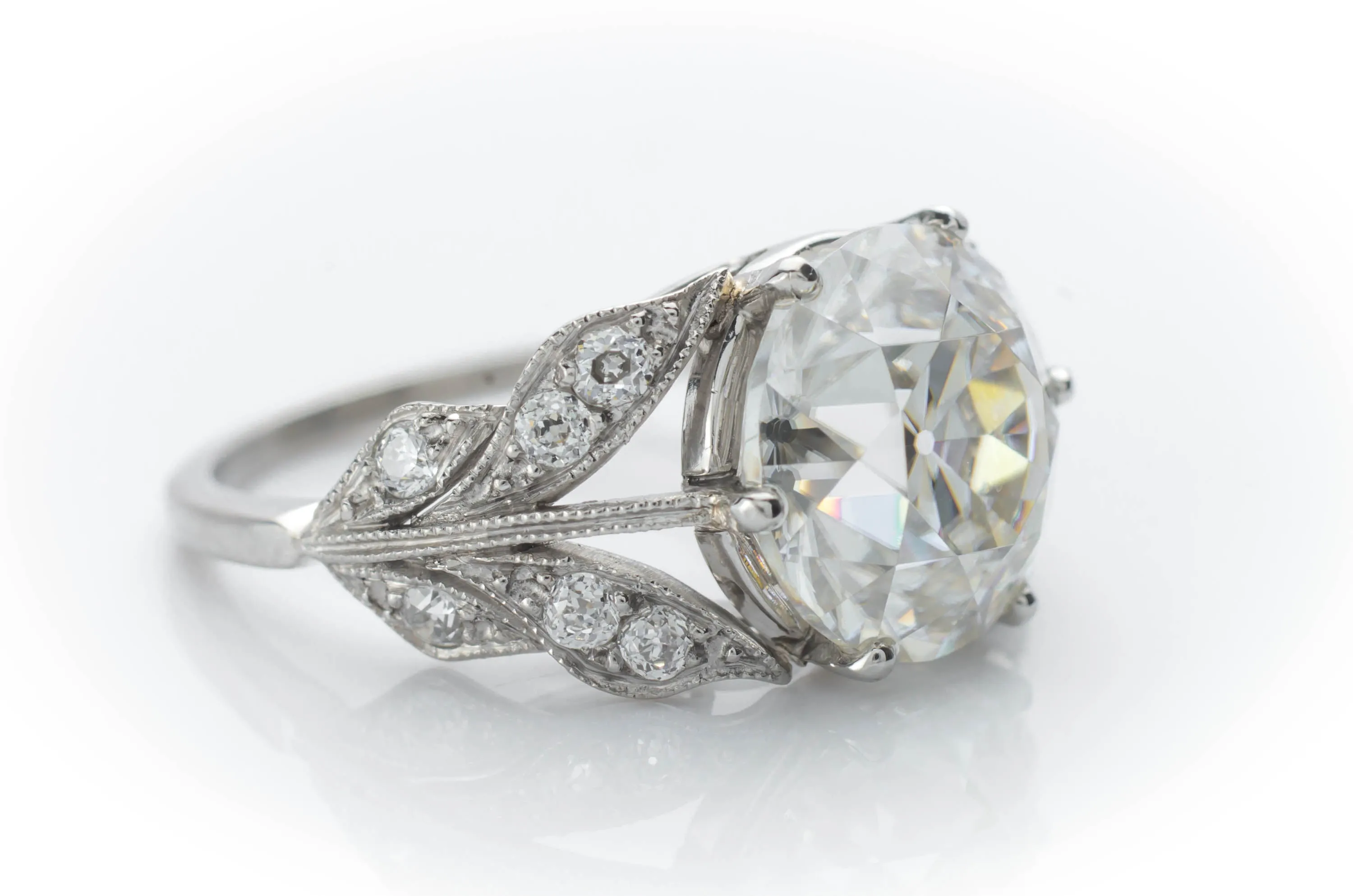 SOLITAIRE IN PLATINUM WITH DIAMOND ACCENTS
