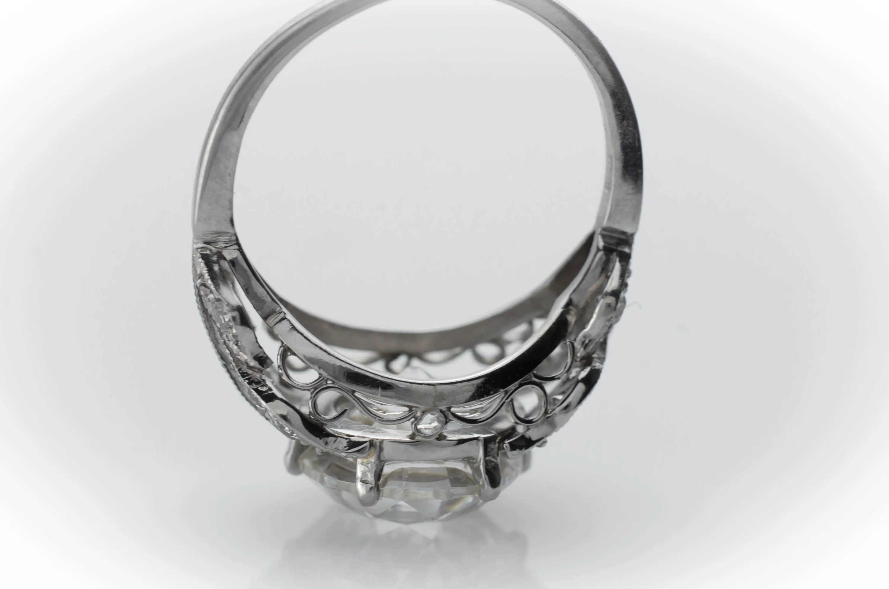 SOLITAIRE IN PLATINUM WITH DIAMOND ACCENTS