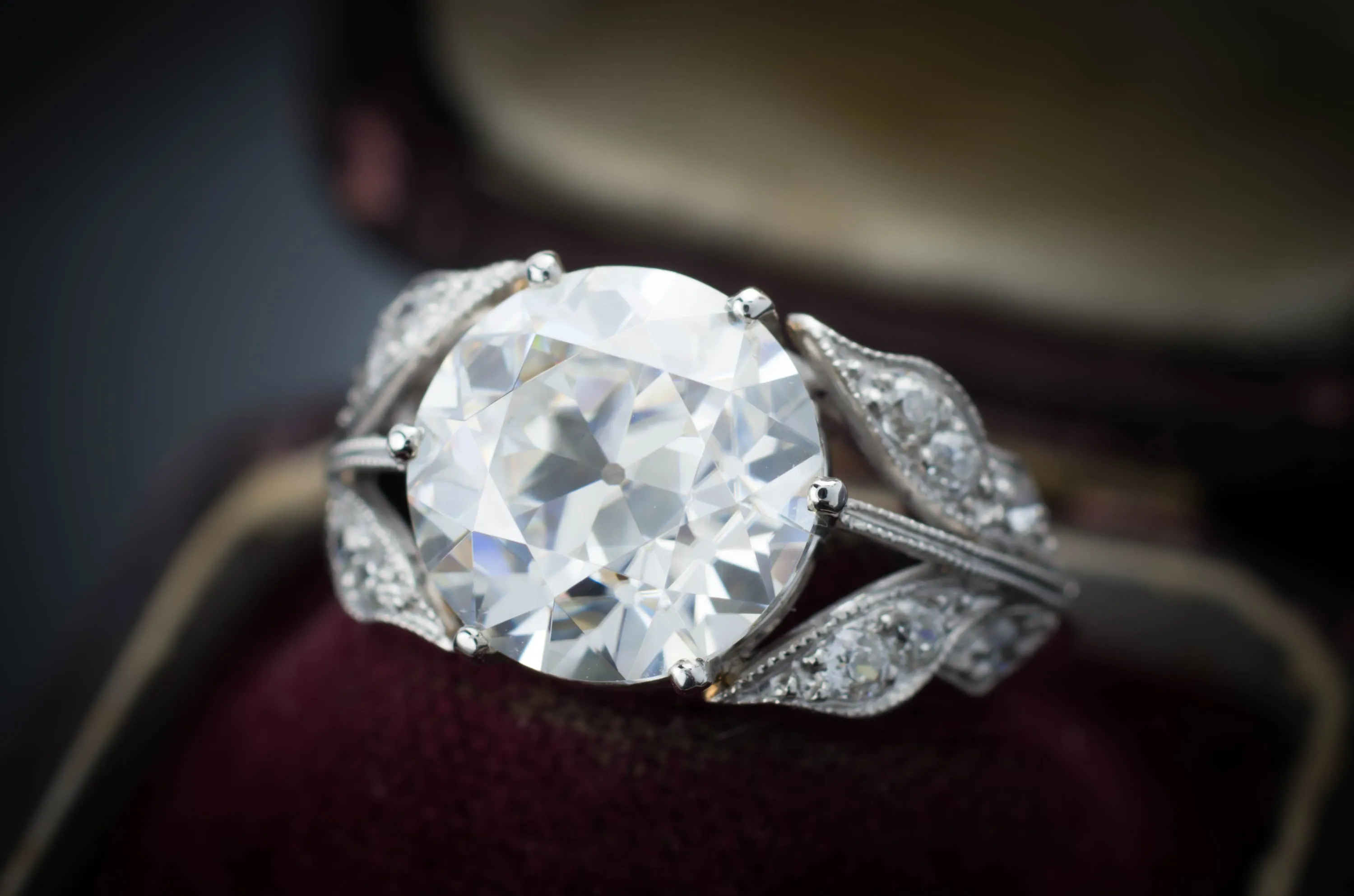 SOLITAIRE IN PLATINUM WITH DIAMOND ACCENTS