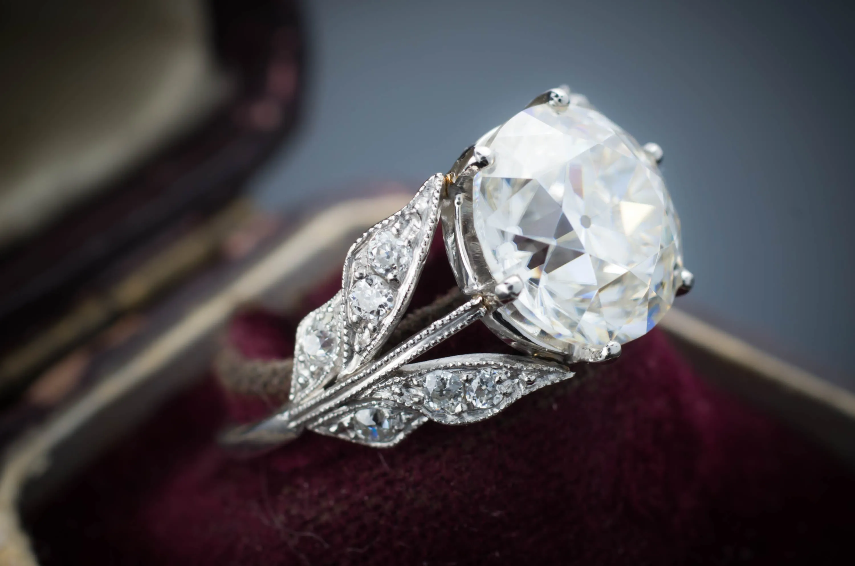 SOLITAIRE IN PLATINUM WITH DIAMOND ACCENTS