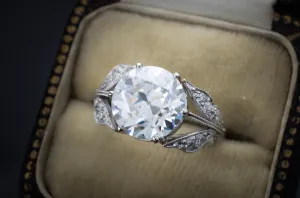 SOLITAIRE IN PLATINUM WITH DIAMOND ACCENTS