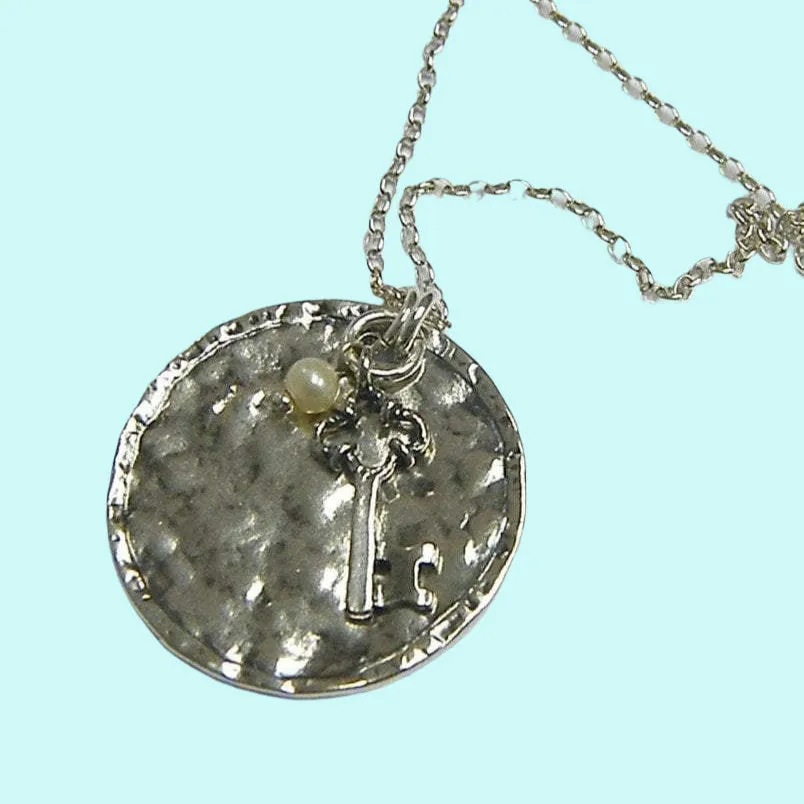 Sterling Silver necklace key motif with dangling pearl