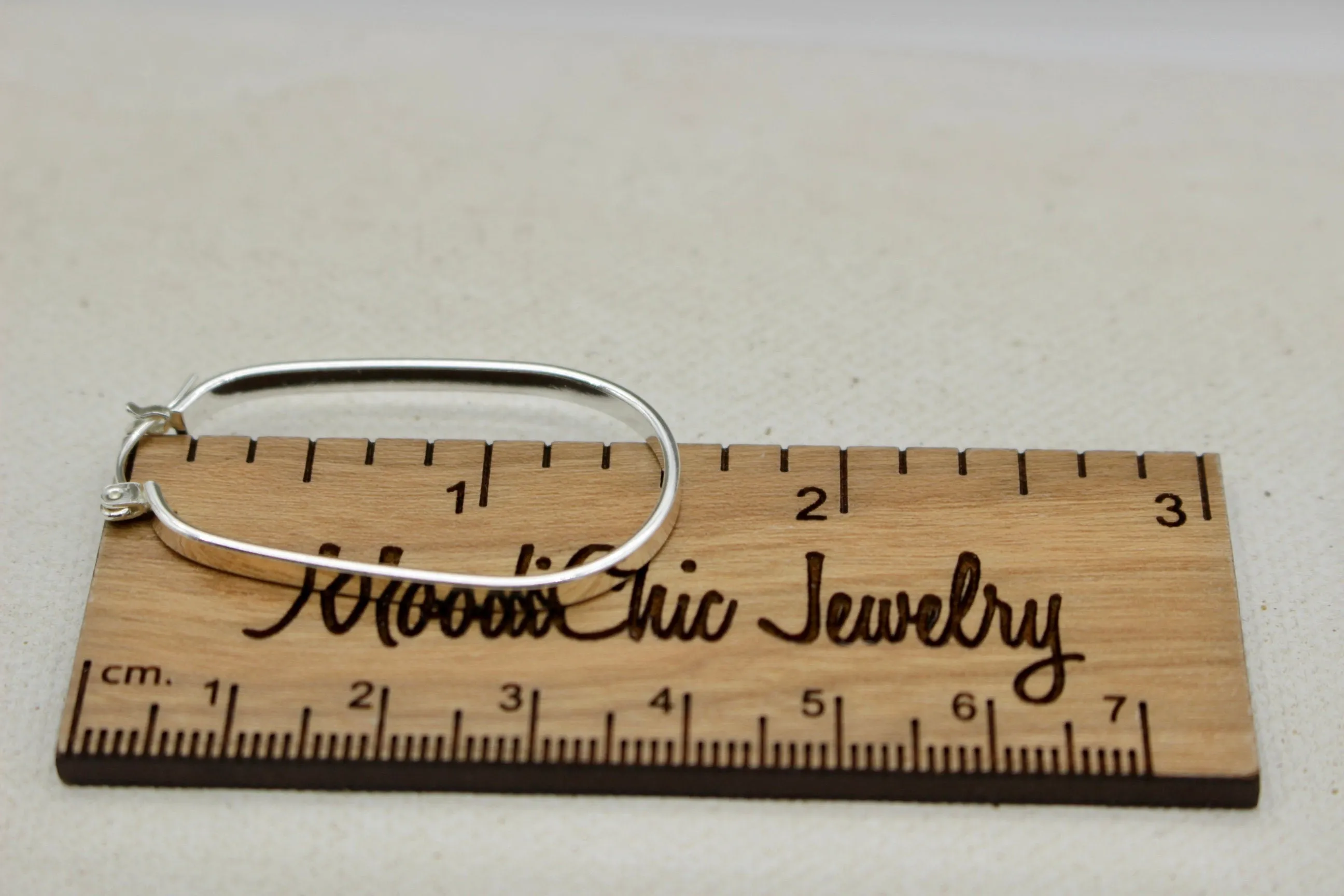 Sterling silver oval hoop earrings