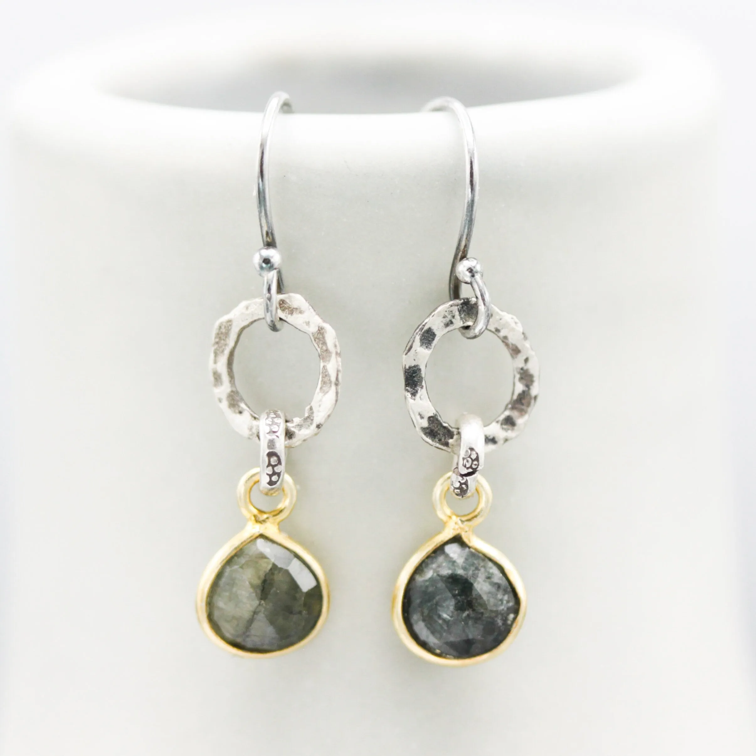 Teardrop faceted Emerald earrings in silver bezel setting with silver circle shape and hooks style on the top